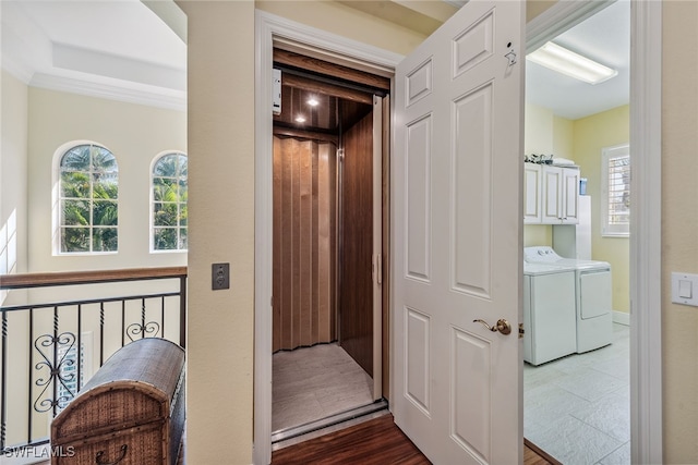 hall featuring washer and dryer and dark hardwood / wood-style floors