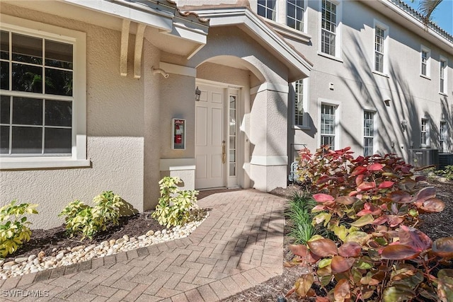 3189 Aviamar Cir Unit 202, Naples, FL 34114 - view of exterior entry featuring stucco siding