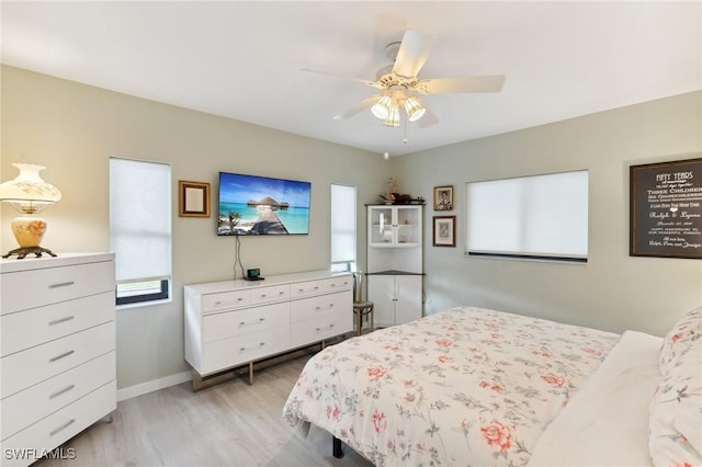 bedroom featuring ceiling fan and light wood-type flooring