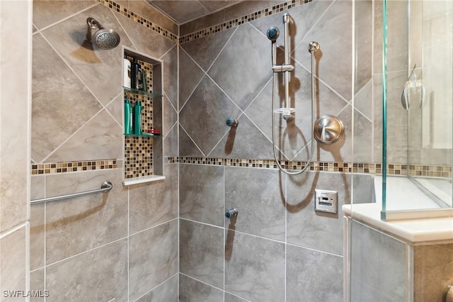 bathroom with a tile shower