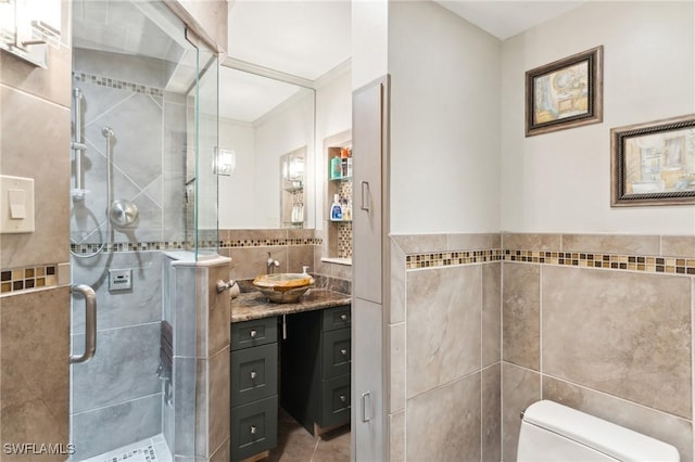 bathroom with vanity and tile walls