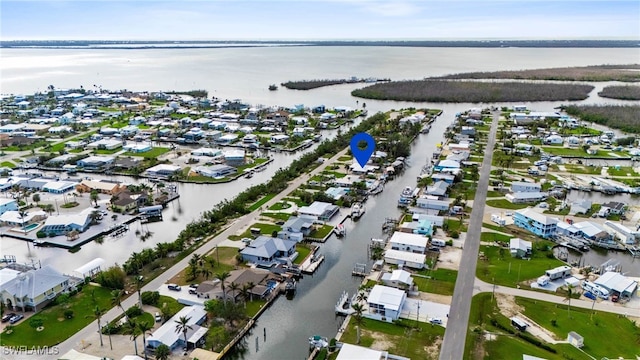 drone / aerial view with a water view