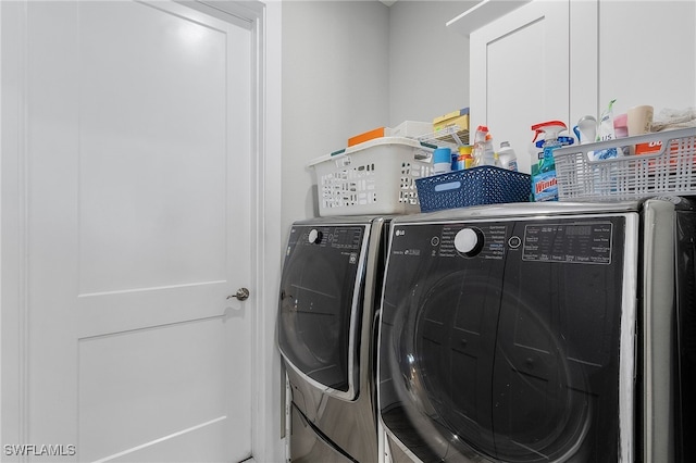 washroom with washer and dryer