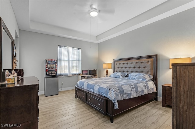 bedroom with ceiling fan and light wood-type flooring