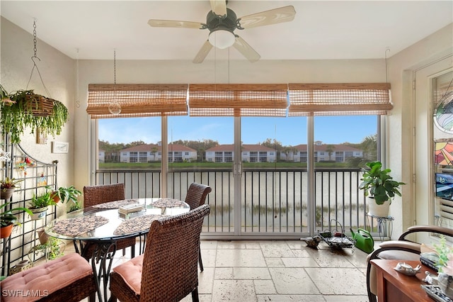 sunroom / solarium with ceiling fan and a healthy amount of sunlight