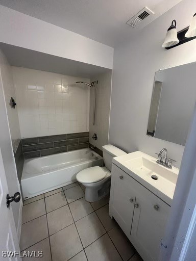 full bathroom with tile patterned floors, vanity, toilet, and tiled shower / bath