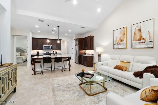 living room featuring vaulted ceiling