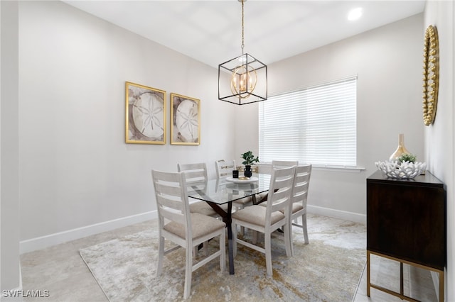 dining space with a notable chandelier