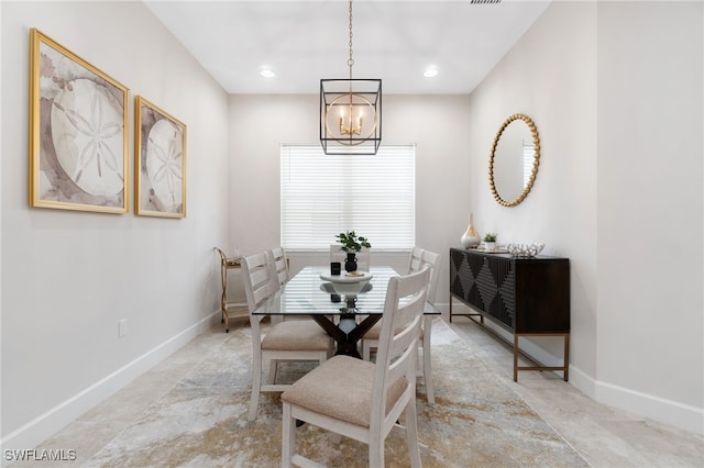 dining space featuring an inviting chandelier