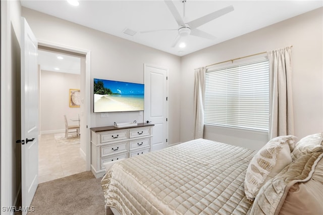 bedroom with light colored carpet and ceiling fan