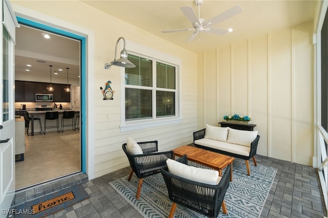 view of patio / terrace with outdoor lounge area and ceiling fan