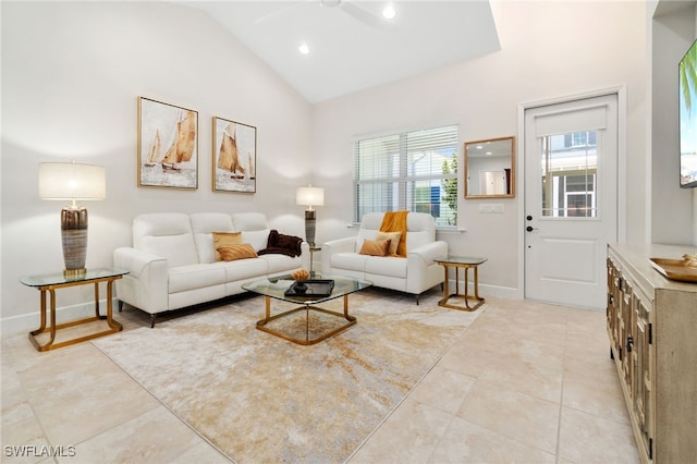 living room with light tile patterned floors, high vaulted ceiling, and ceiling fan