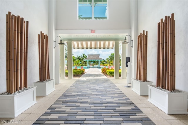 interior space with plenty of natural light and a high ceiling