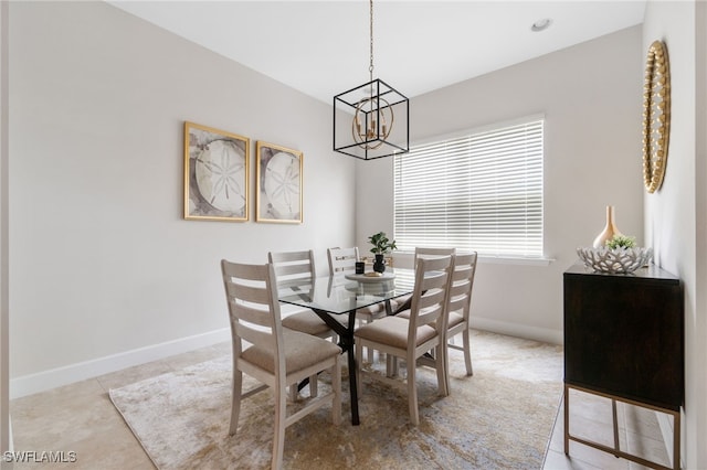 dining space with light tile patterned floors and an inviting chandelier