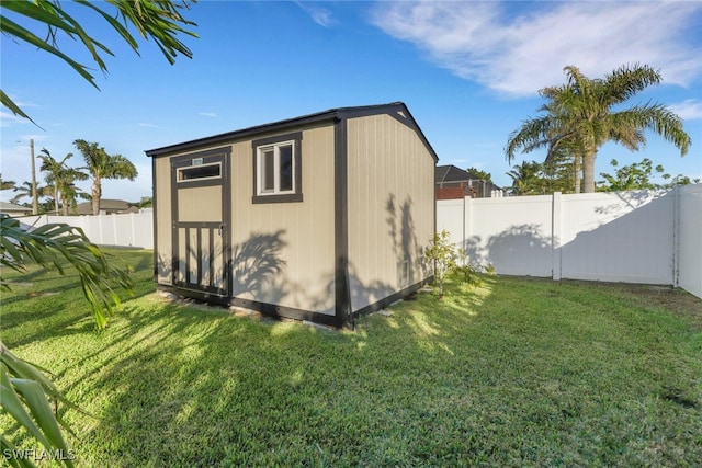 view of outbuilding with a lawn