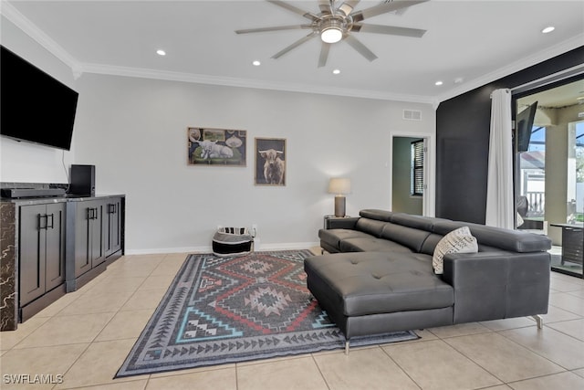 living room with light tile patterned floors, ceiling fan, and crown molding