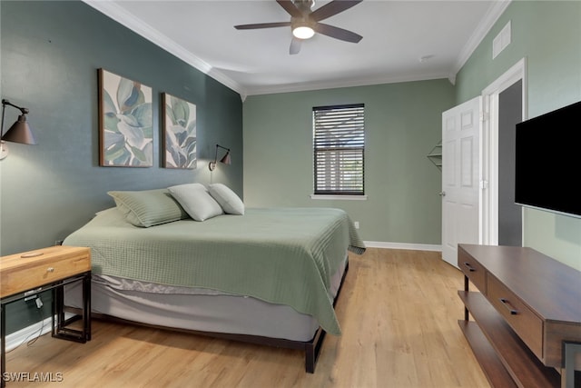 bedroom with ceiling fan, crown molding, and light hardwood / wood-style floors