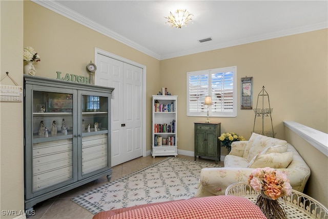 living area with tile patterned flooring and ornamental molding