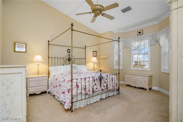 carpeted bedroom with ceiling fan and ornamental molding