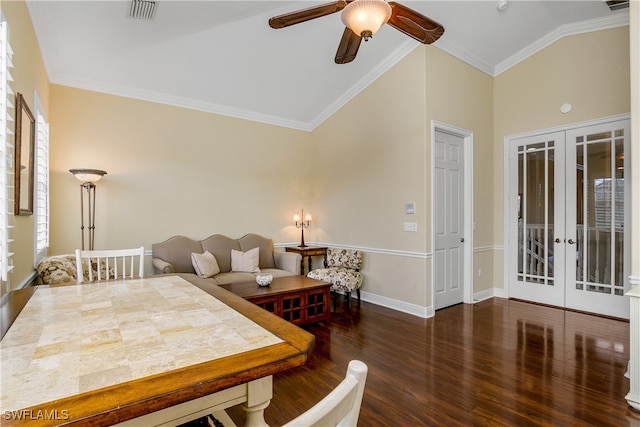 dining area featuring ceiling fan, french doors, dark wood-type flooring, crown molding, and vaulted ceiling