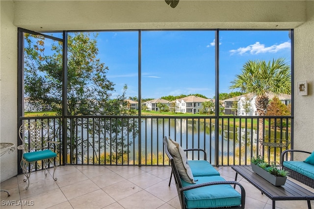 unfurnished sunroom with a water view