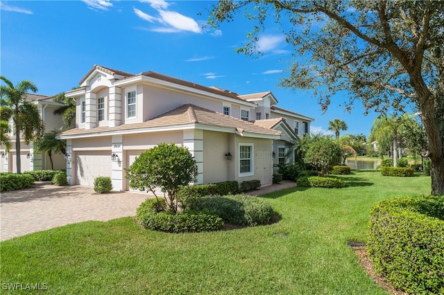 view of property exterior with a garage and a yard