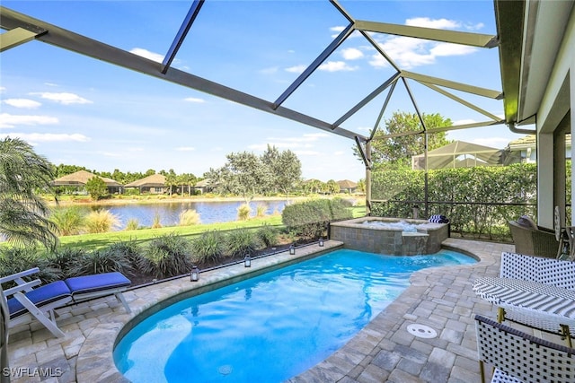 view of swimming pool with a patio area, an in ground hot tub, a water view, and glass enclosure