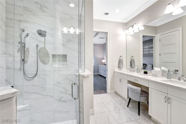 bathroom with vanity, a shower with shower door, and crown molding