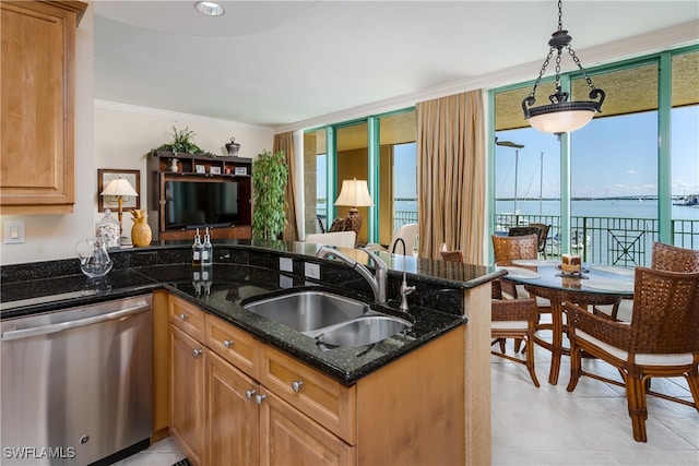 kitchen featuring ornamental molding, dark stone counters, sink, decorative light fixtures, and dishwasher