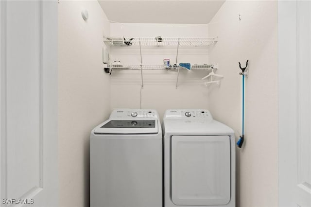 washroom featuring laundry area and independent washer and dryer