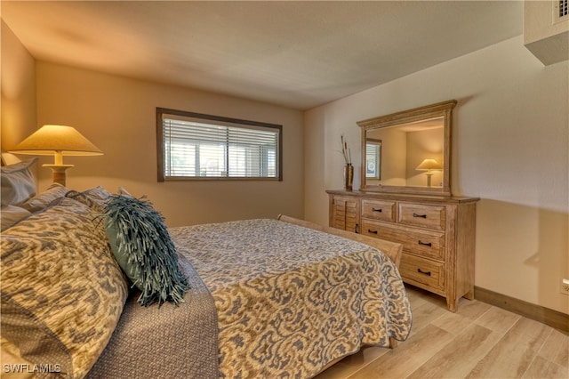 bedroom with light wood-type flooring