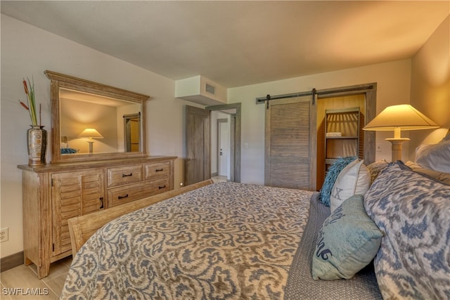 bedroom with a barn door