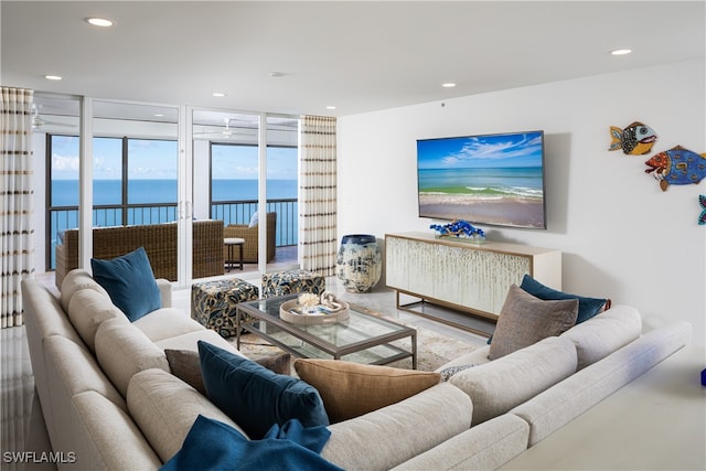 living room featuring floor to ceiling windows