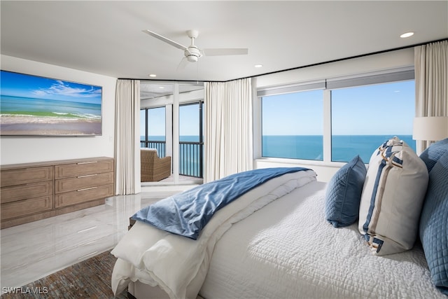 bedroom featuring access to outside, a water view, and ceiling fan