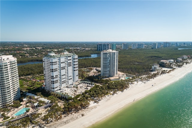 aerial view with a water view and a view of the beach