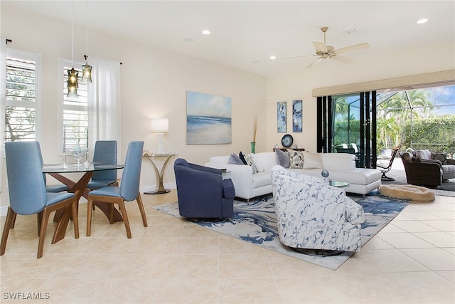 tiled living room featuring a wealth of natural light and ceiling fan