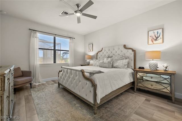 bedroom featuring wood-type flooring and ceiling fan