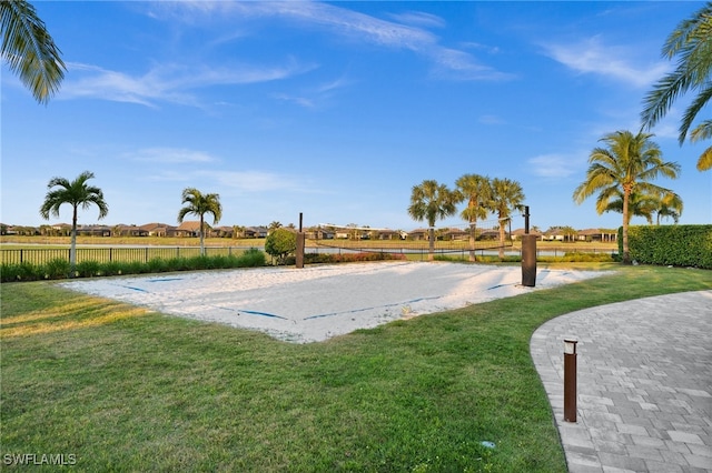 view of home's community with a yard and volleyball court