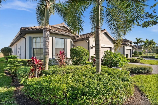 view of side of property featuring a garage