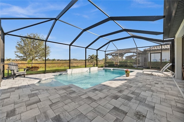 view of swimming pool featuring a patio, pool water feature, and a lanai