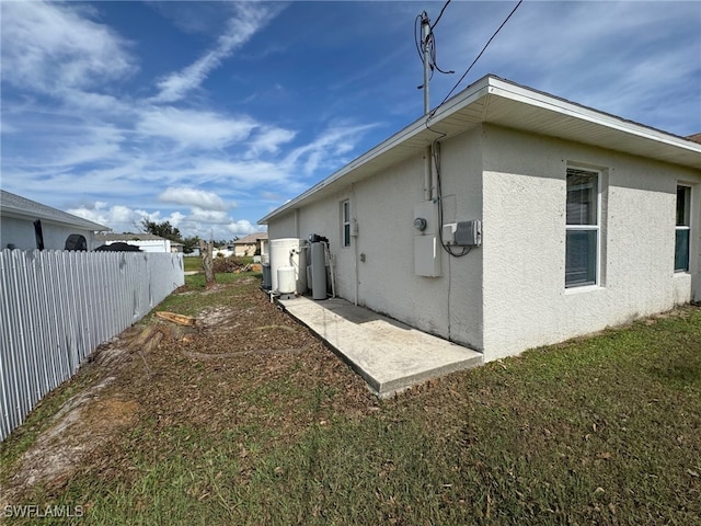 view of property exterior featuring a lawn