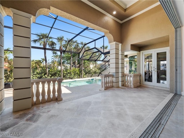 view of patio featuring glass enclosure and french doors