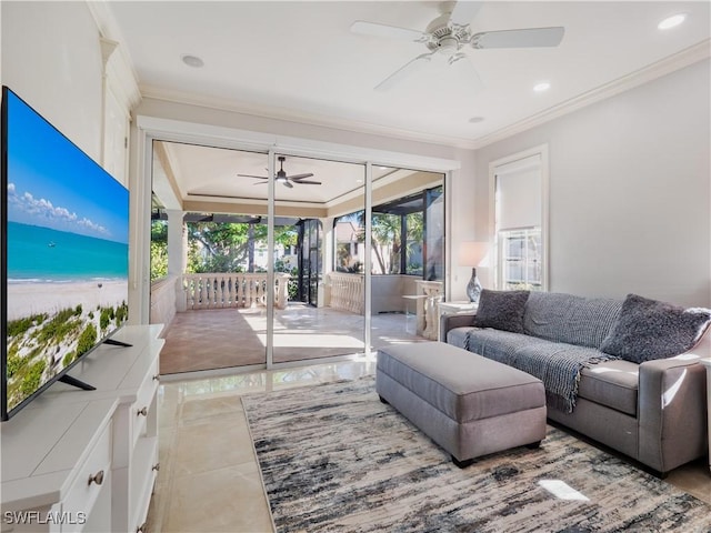 tiled living room with ceiling fan and crown molding