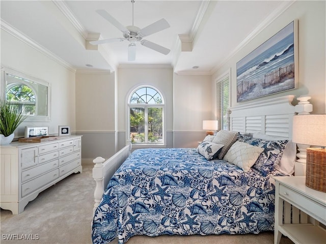 carpeted bedroom with ceiling fan and crown molding