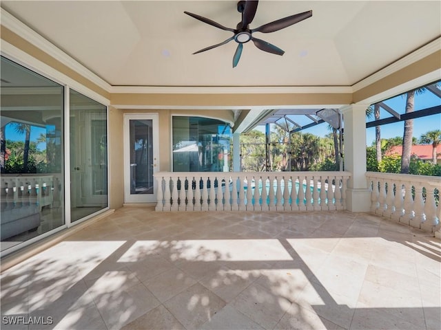 unfurnished sunroom with ceiling fan and vaulted ceiling