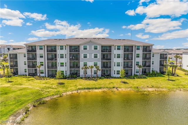 view of building exterior with a water view