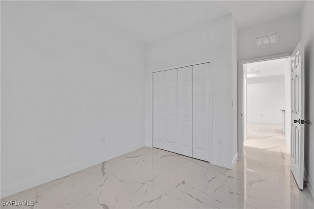 unfurnished bedroom with a closet