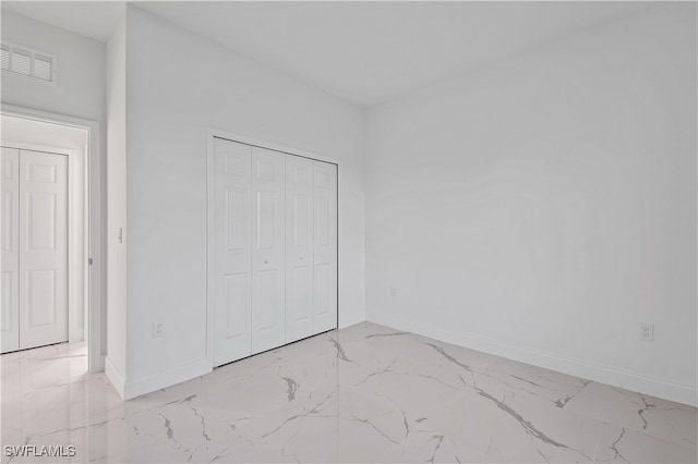 unfurnished bedroom with a closet