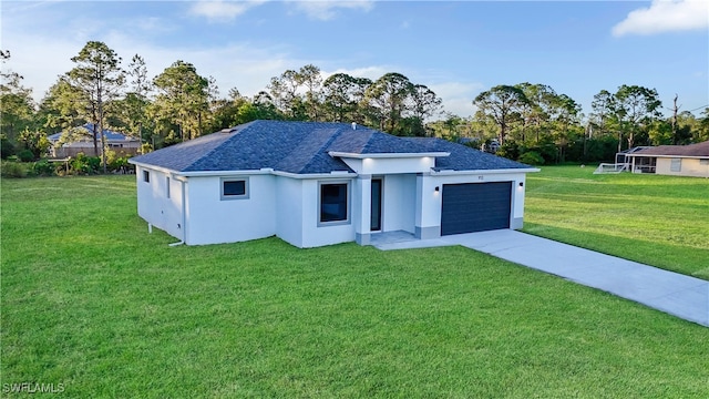 view of front of house featuring a garage and a front lawn