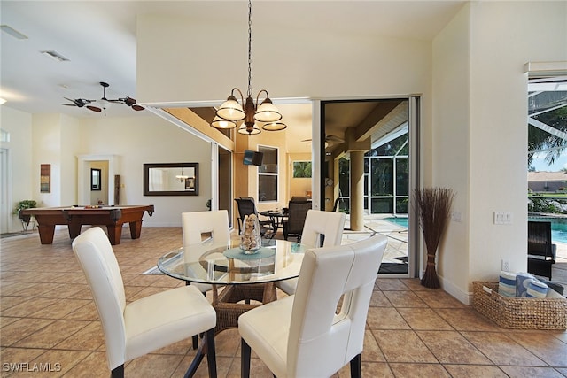 tiled dining area featuring ceiling fan with notable chandelier and billiards